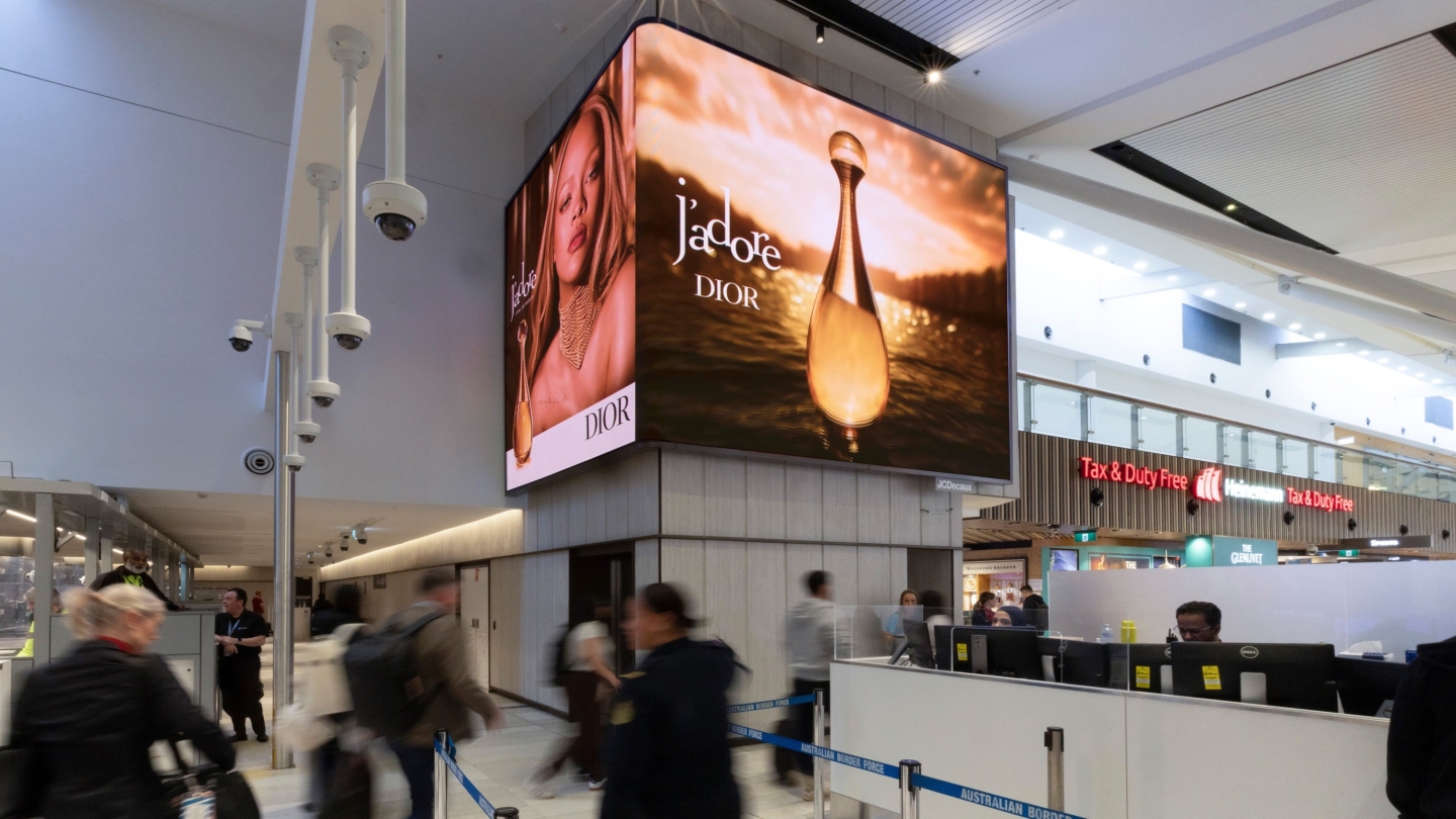 JCDecaux advertising screens inside Sydney International Airport