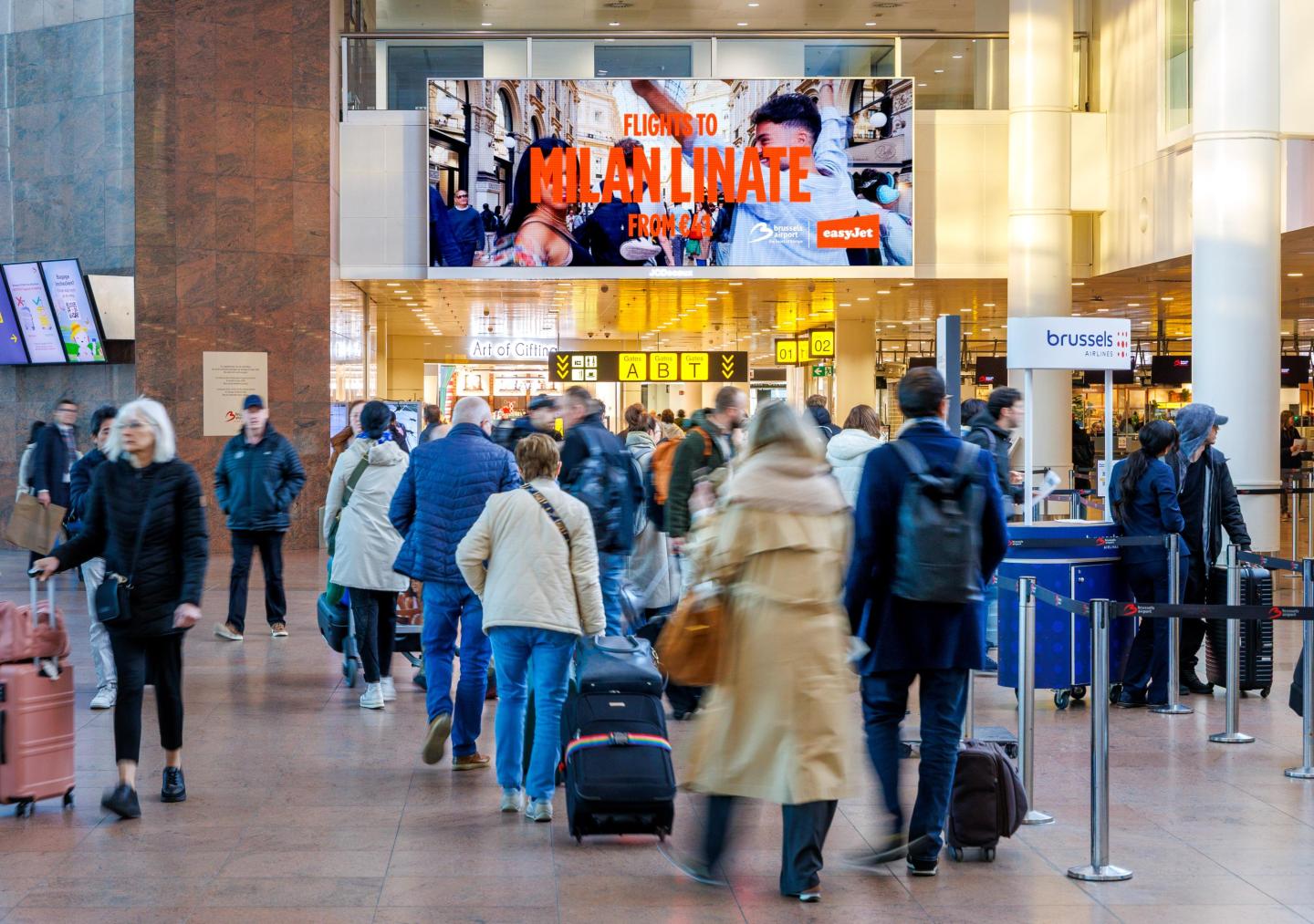 DOOH - Airport Advertising - Brussels Airport - Escapade citytrips - Milan Easy Jet
