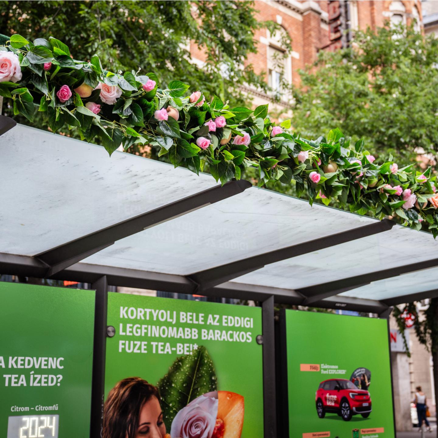 A roof decorated with flowers on the JCDecaux bus shelter in Budapest for the Fuze tea campaign
