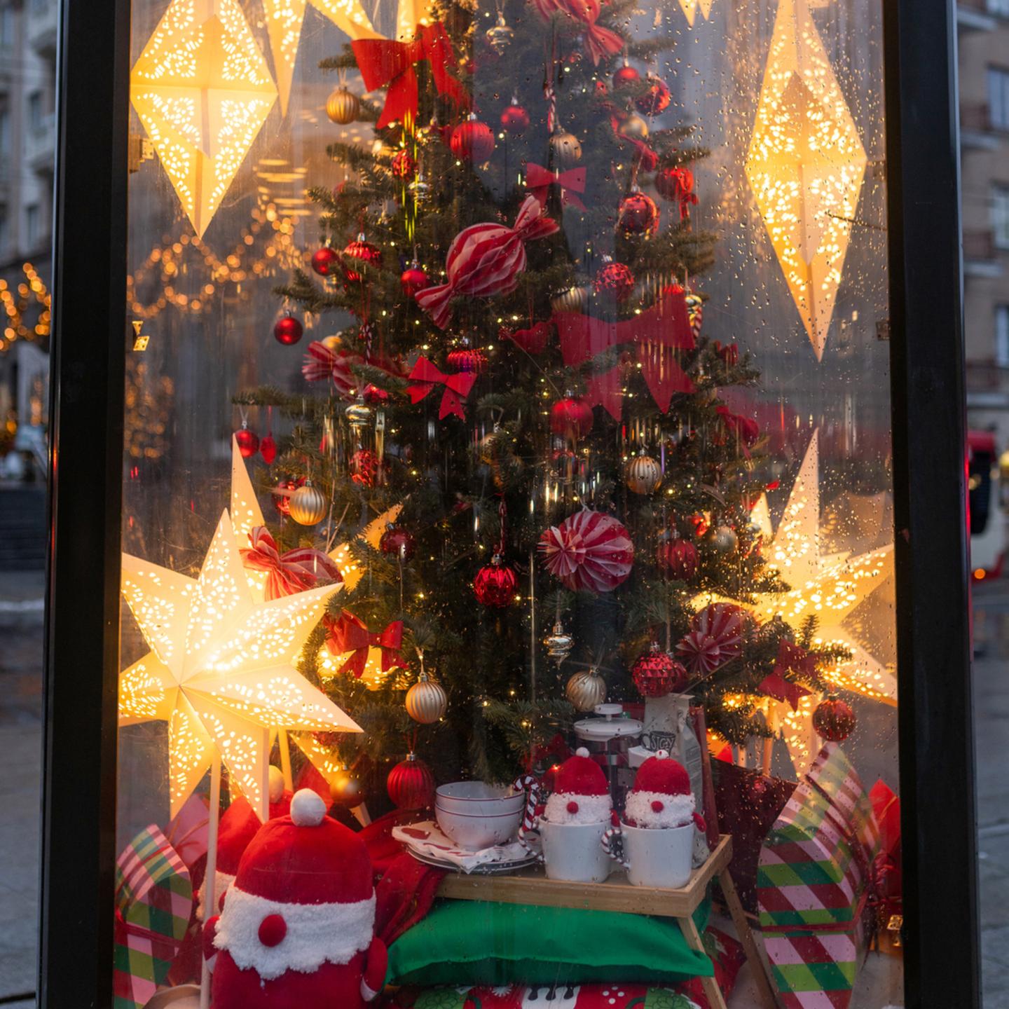 IKEA Christmas installation on a JCDecaux street column in Vilnius with decorated tree and presents