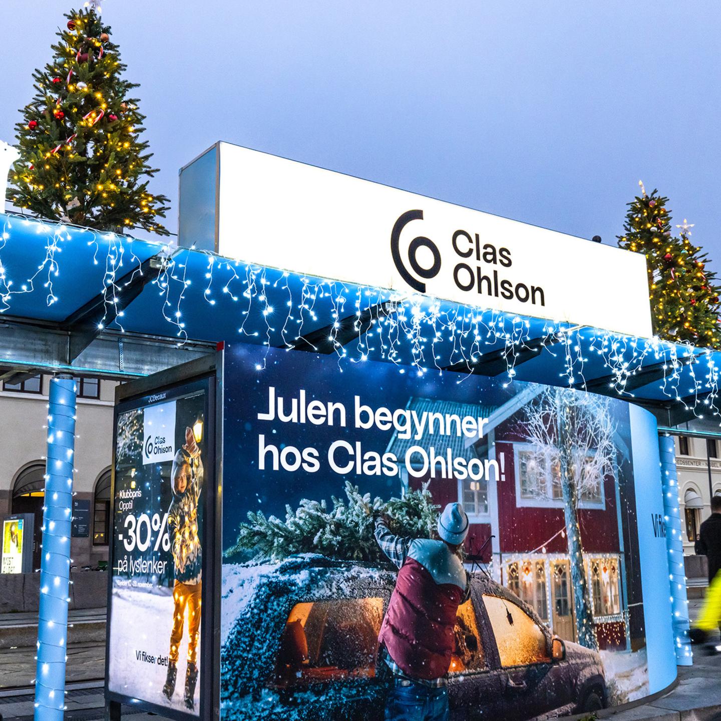 JCDecaux street furniture at Aker Brygge decorated with festive lights for Clas Ohlson