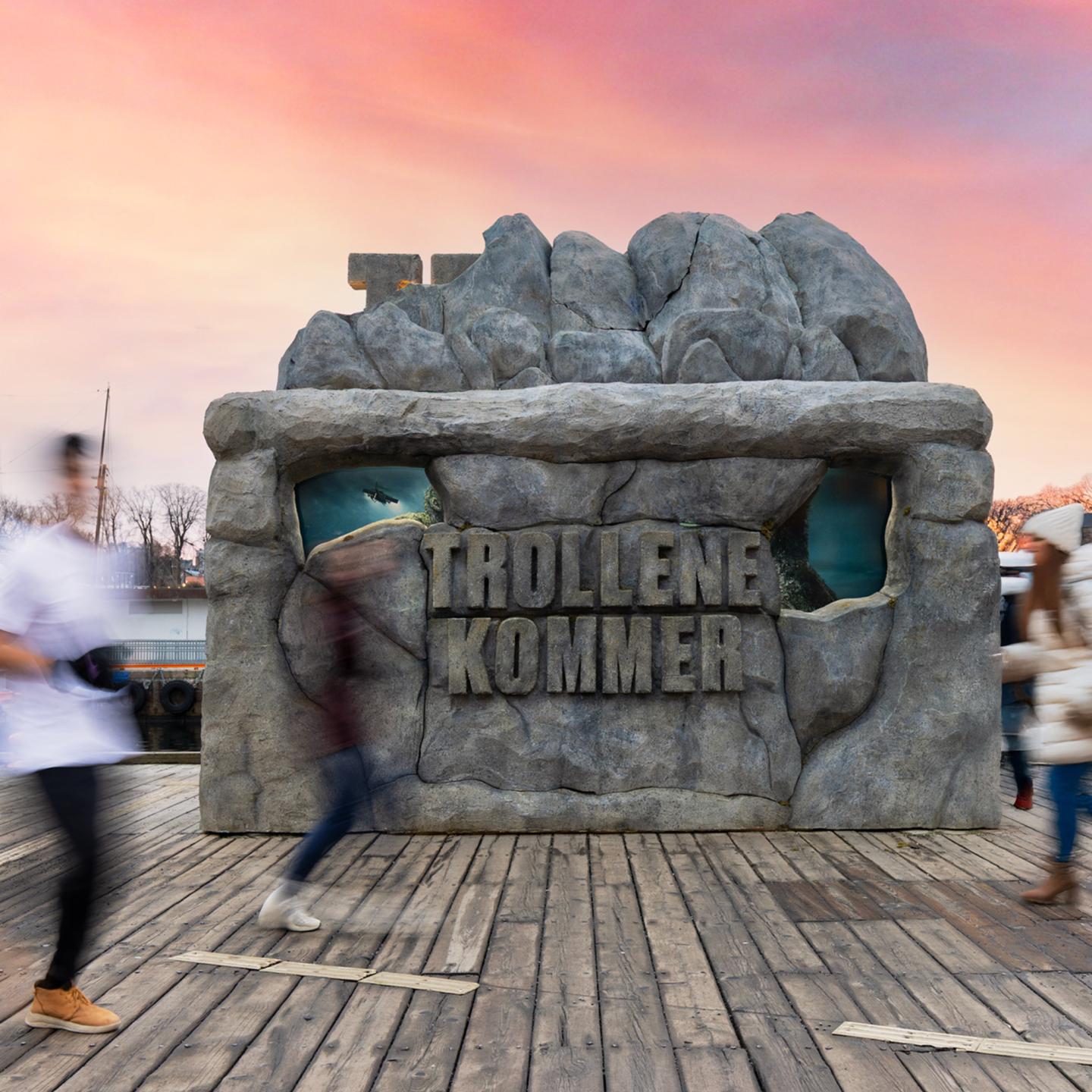 JCDecaux bus shelter in Oslo covered with stones for a progressive “Troll 2” campaign reveal