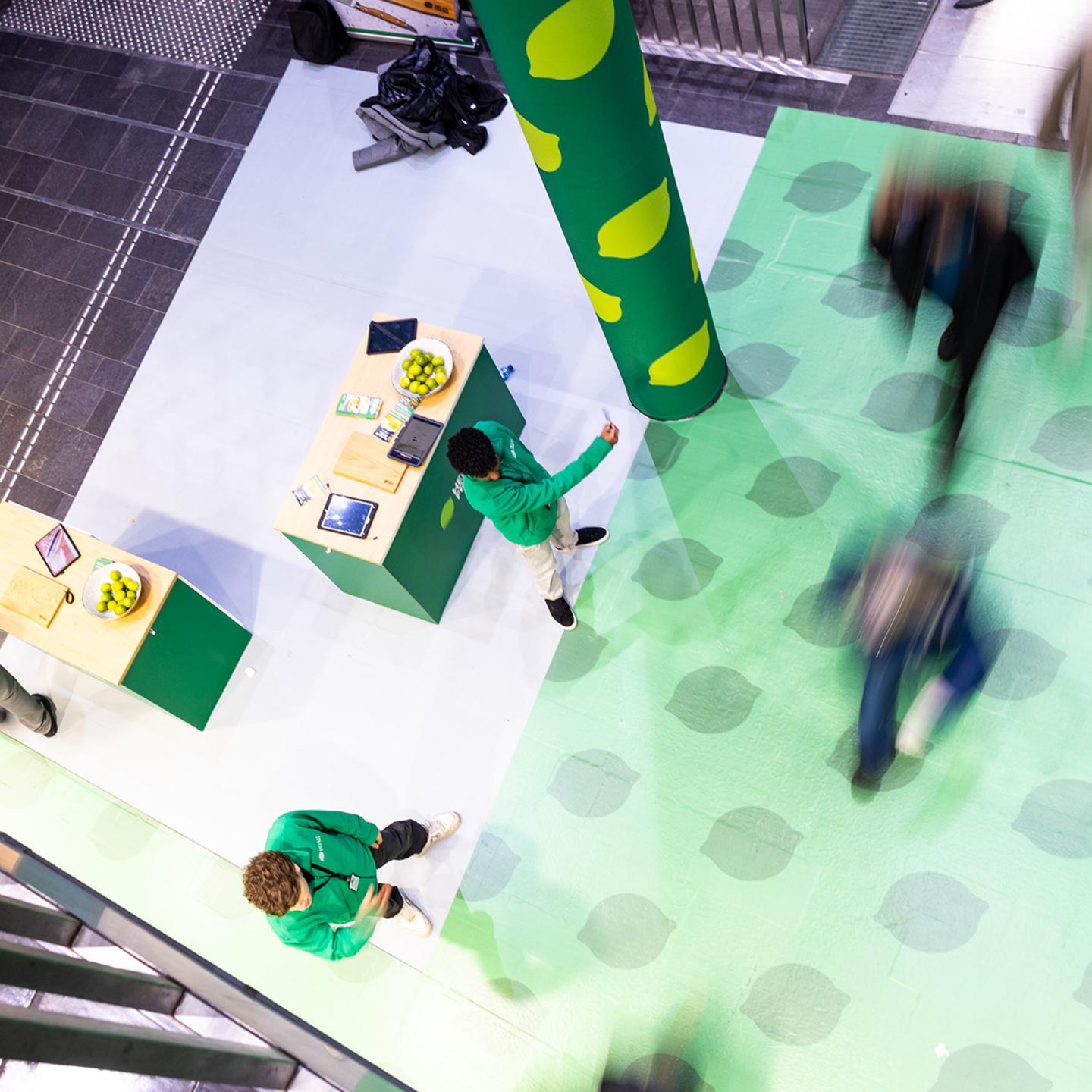 JCDecaux Norway out-of-home advertising for HelloFresh in Oslo Central Station, with large green visuals and food imagery catching the attention of passing commuters.