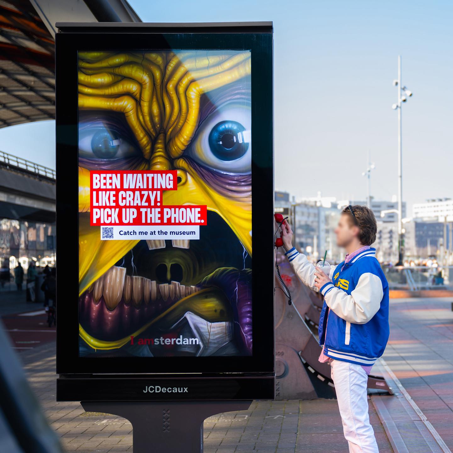 Close-up of an antique telephone installed on JCDecaux street furniture, inviting people to “call” the artwork’s main character.
