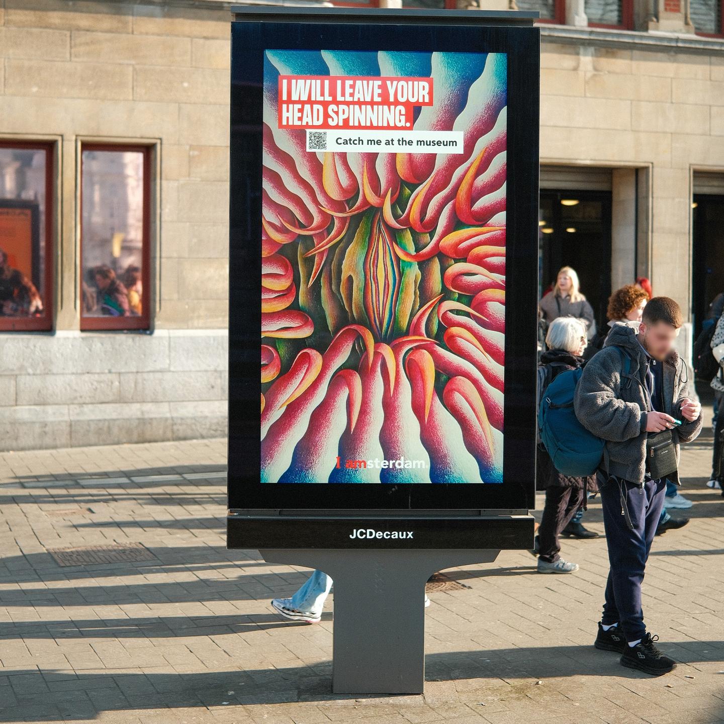 Passers-by interacting with an outdoor advertising panel that features an iconic artwork from an Amsterdam museum.