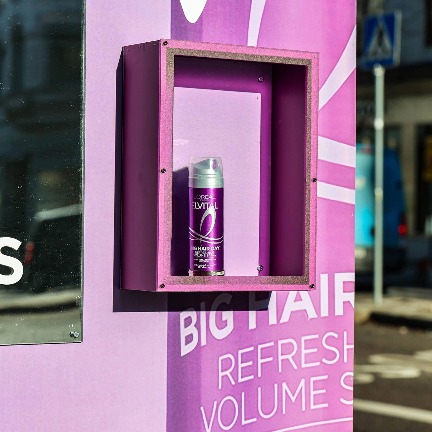Close-up of JCDecaux urban furniture in Stockholm displaying L'Oréal Professionnel Paris Elvital Collagen Lifter OOH campaign, with the mirror and product on the side.