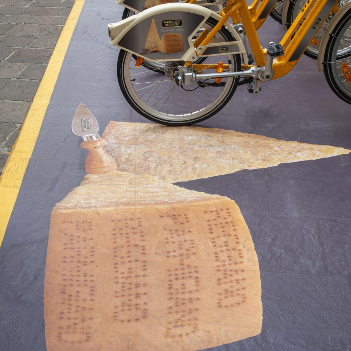 IGPDecaux OOH activation: Parmigiano Reggiano branded bikes follow Milan’s urban flows for maximum visibility.