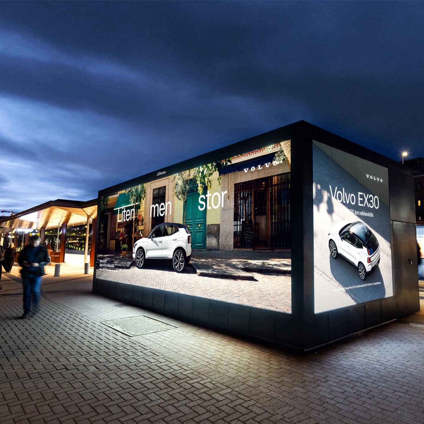 A JCDecaux billboard at Majorstuen metro station with the Oslo skyline and ski jump in the distance