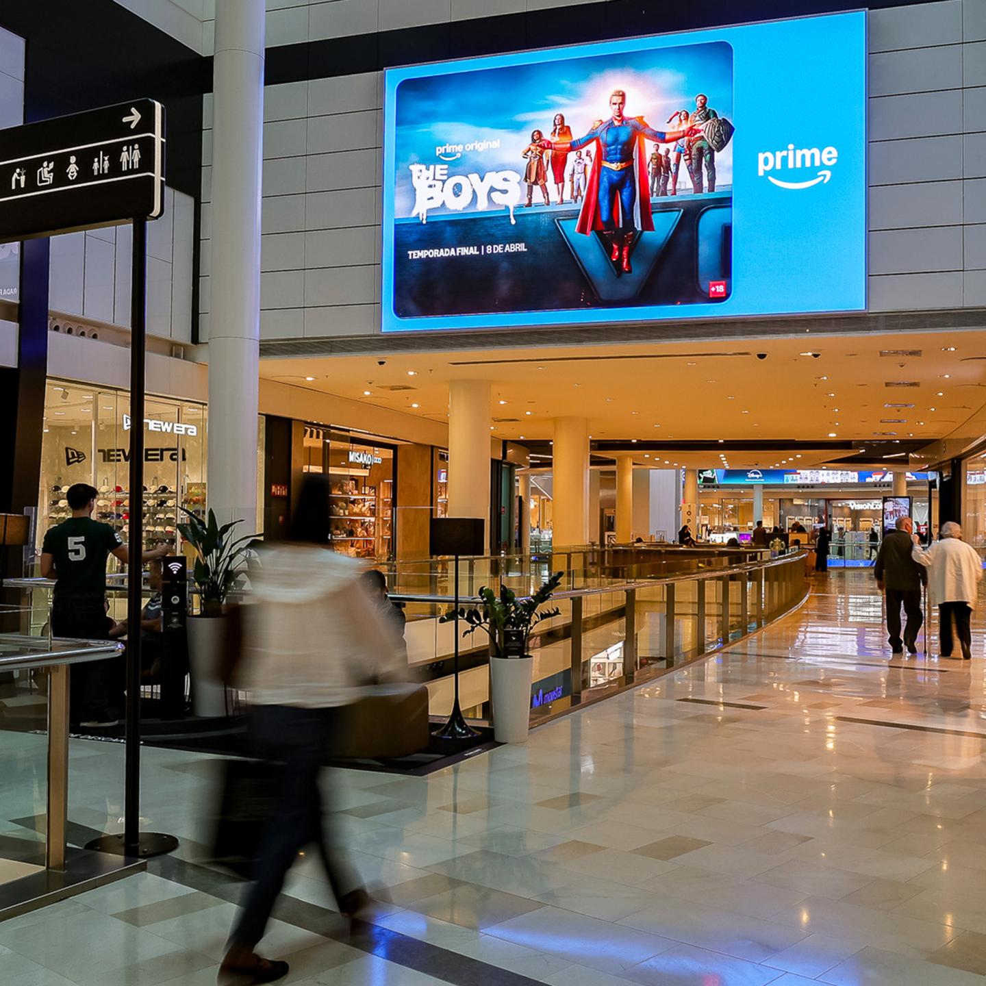 High-impact visual branding of The Boys series across multiple digital OOH screens in a retail environment.