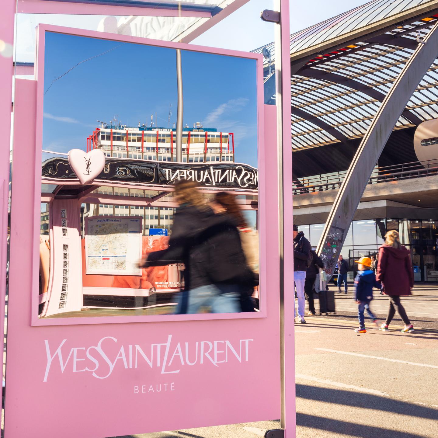 A premium pink bus shelter custom-designed by JCDecaux for the Yves Saint Laurent Lovenude fragrance launch in Amsterdam.