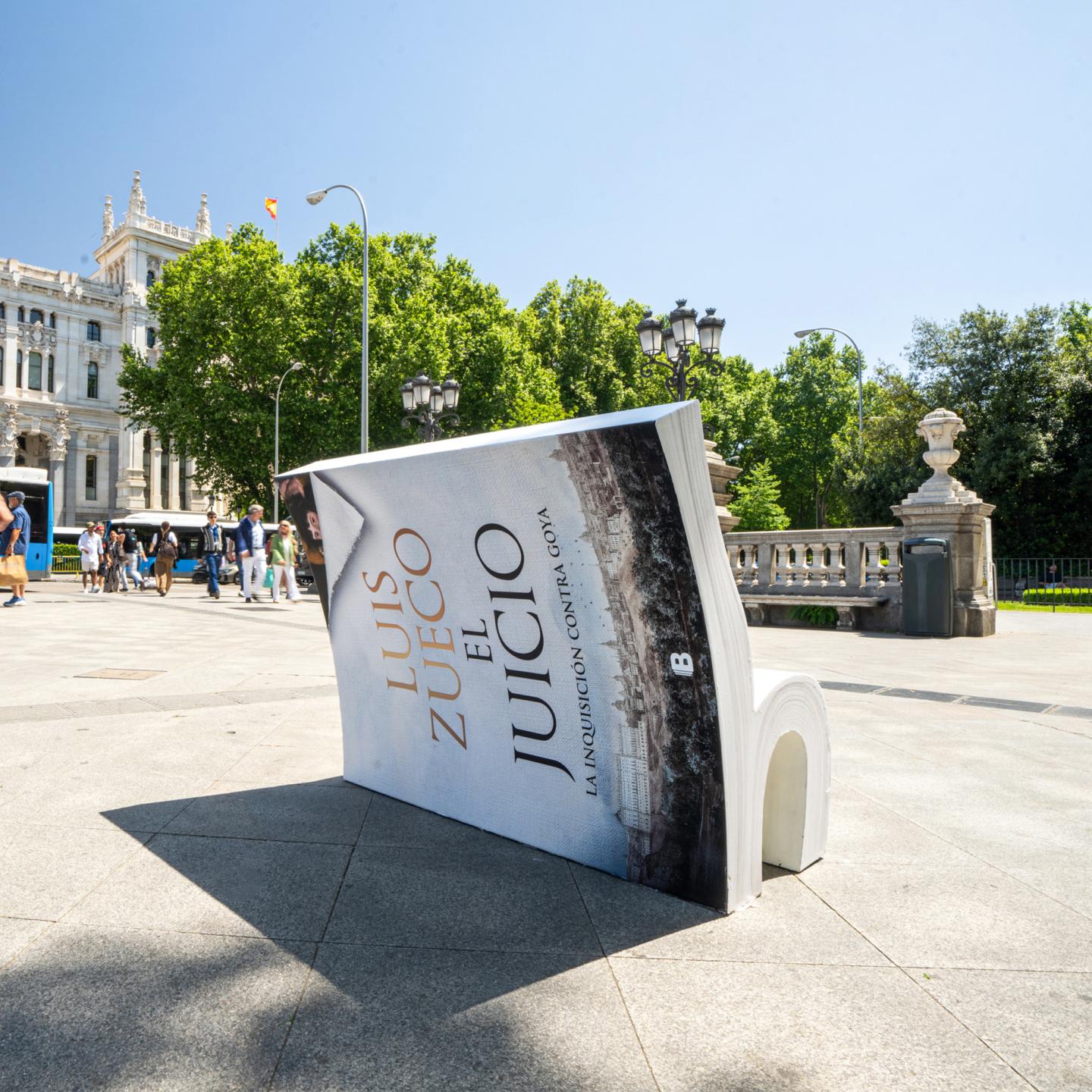 JCDecaux campaign book bench displayed in a public space in Madrid.