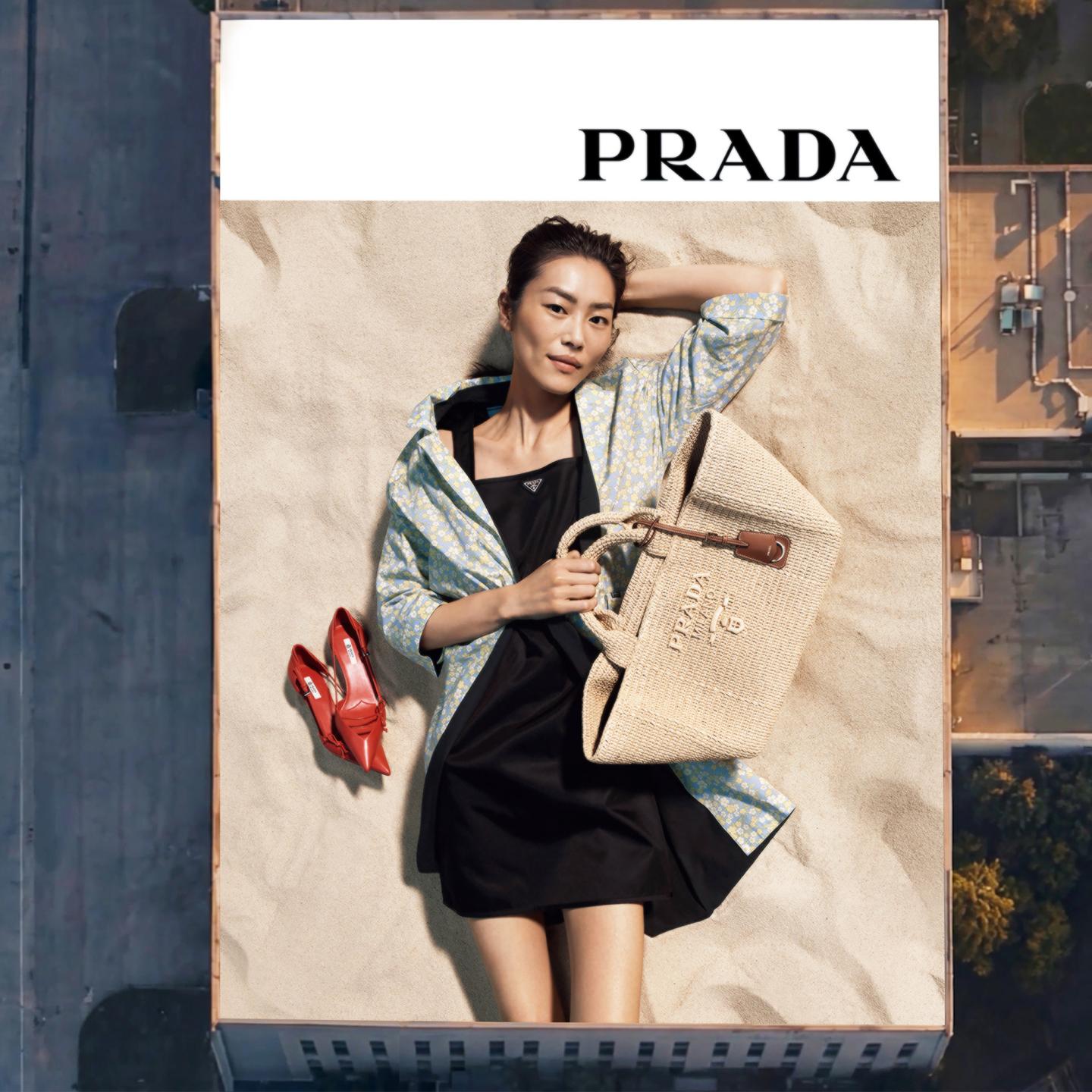 Close-up of renowned supermodel Liu Wen on the Prada “Days of Summer 2026” creative displayed on a premium SAMDecaux billboard at Shanghai Hongqiao Airport FBO.