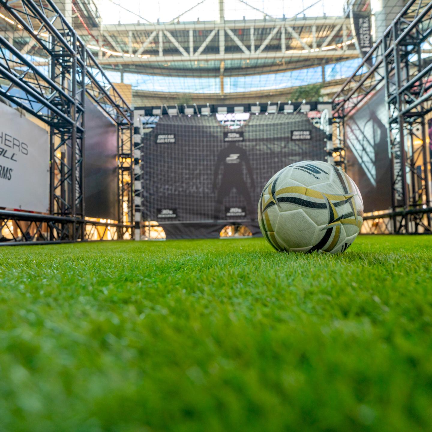 Front view of the Skechers football structure with brand visuals and boot graphics at La Gavia