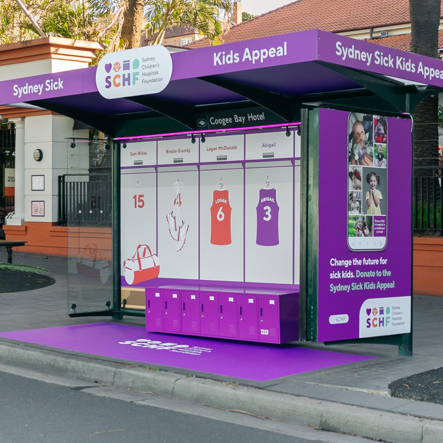 Close‑up of interactive bus shelter panel inviting passers‑by to press a button and hear a child’s story.