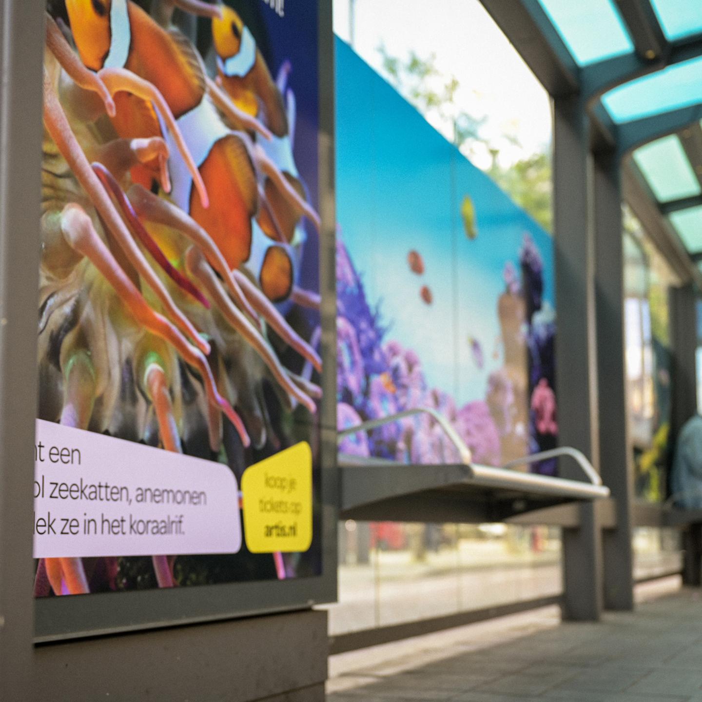JCDecaux tram stop wrapped in aquarium imagery, creating the illusion of swimming among fish in the middle of the street.