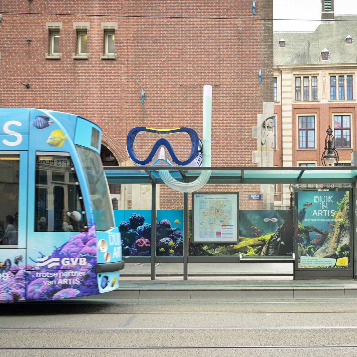 JCDecaux bus shelter in central Amsterdam fully covered with marine visuals of fish and corals for the Year of Water campaign with Artis Zoo.