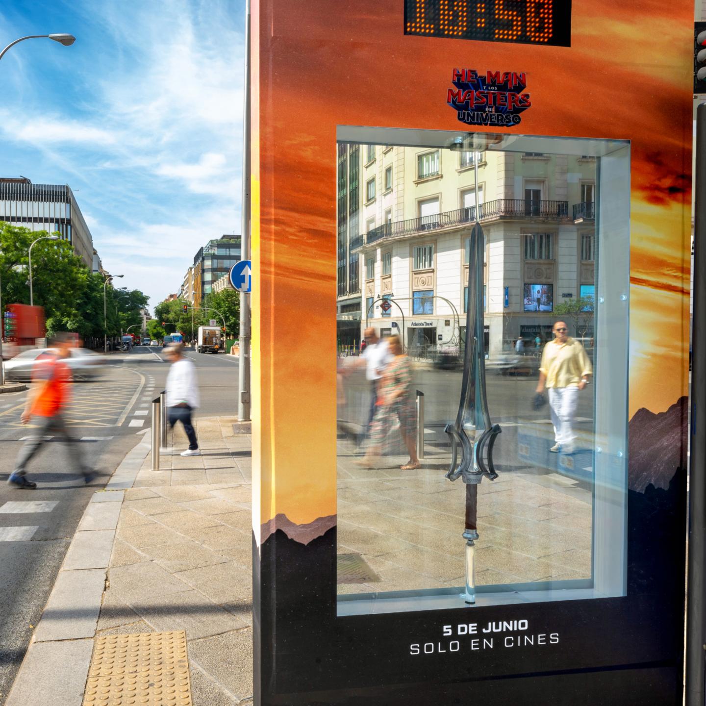 JCDecaux Spain special-build bus shelter in Madrid featuring a backlit Power Sword for the Masters of the Universe film campaign.