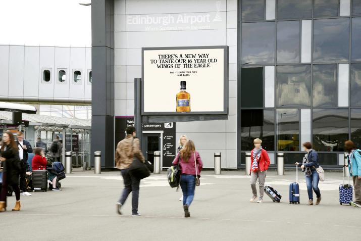 a large billboard advertising at Edinburgh Airport