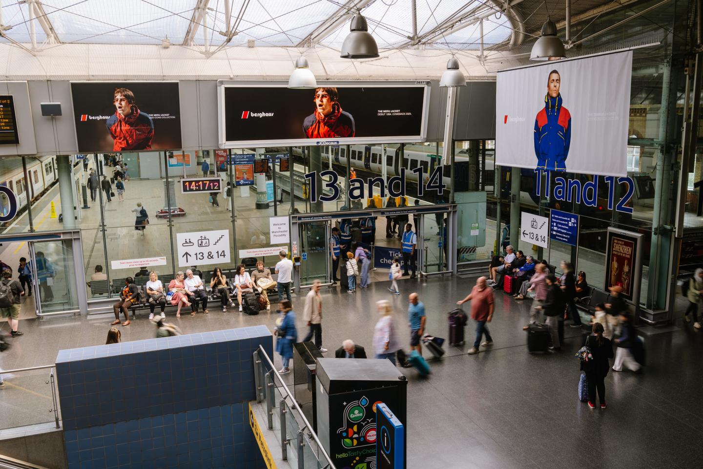 A Berghaus Out-of-Home advertising campaign displayed in the Manchester Piccadilly station concourse.