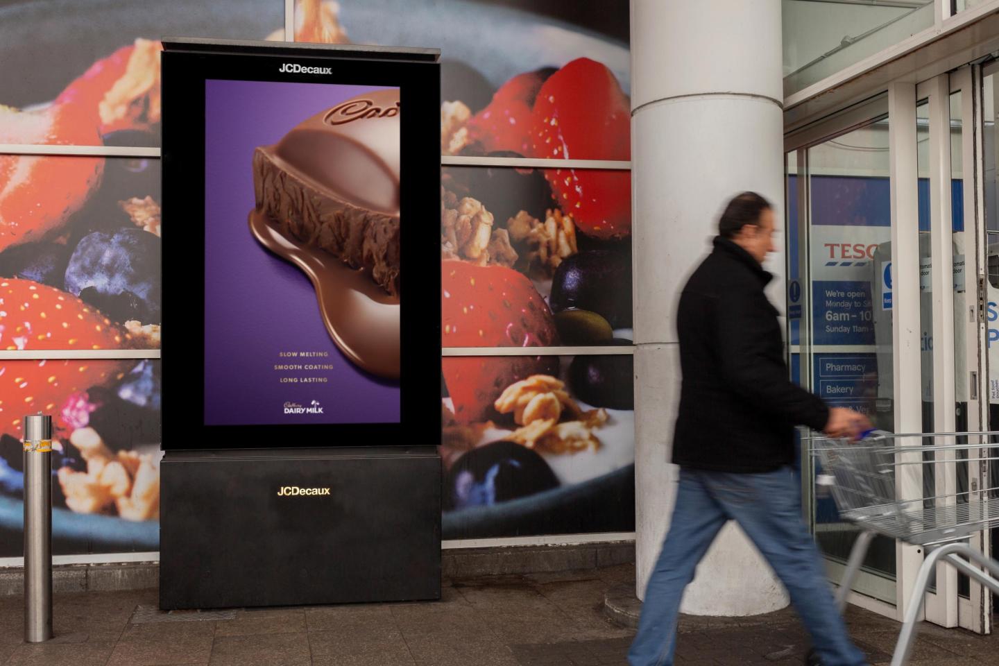 an out-of-home advertising campaign for Cadbury at a Tesco supermarket