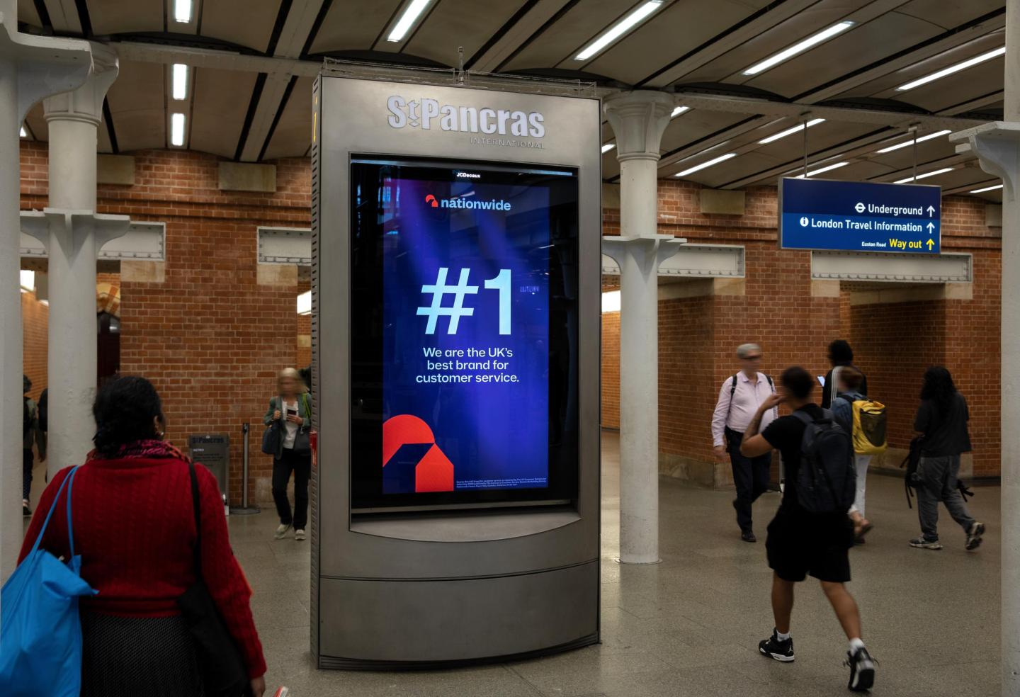 a digital advertising screen at london st pancras station