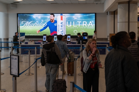 Michelob Ultra advertises their FIFA sponsorship for the club cup on digital airport screen in LAX security area
