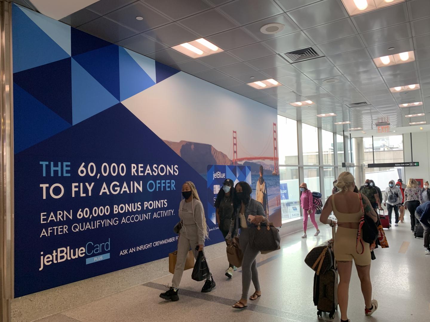 JetBlue card wall wrap advertisement at Boston Logan airport