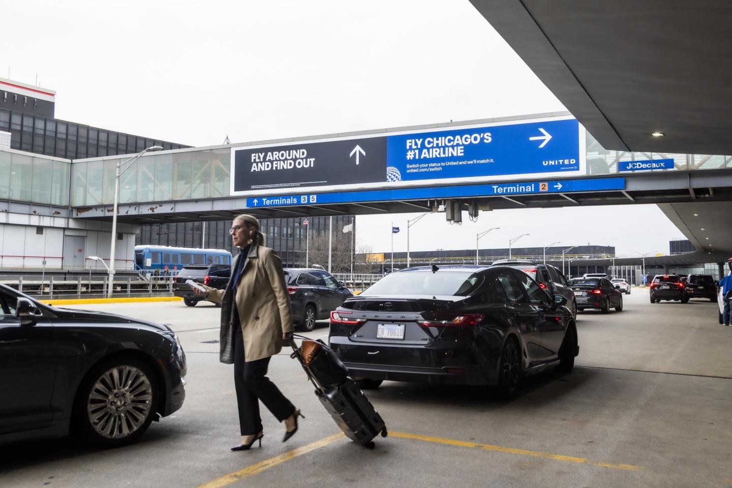 United Airlines advertises over roadway at Chicago O'Hare International Airport